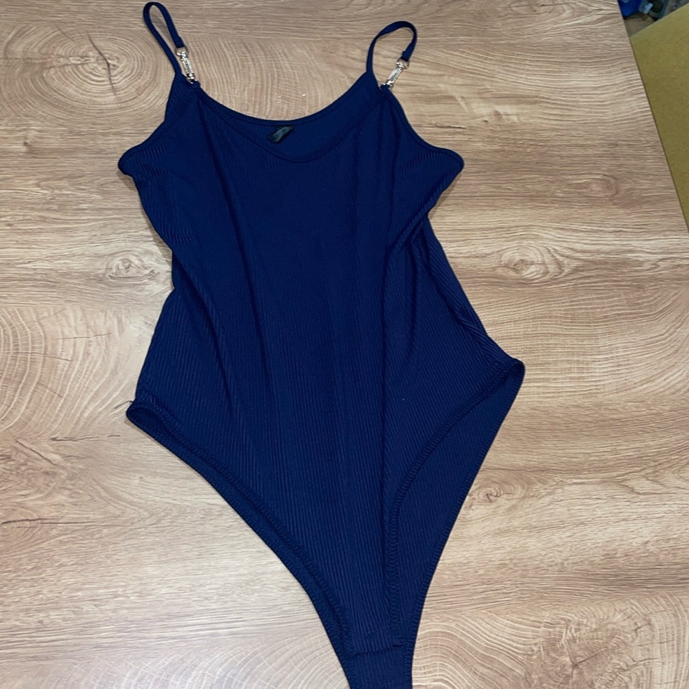 Navy blue bodysuit with gold accents